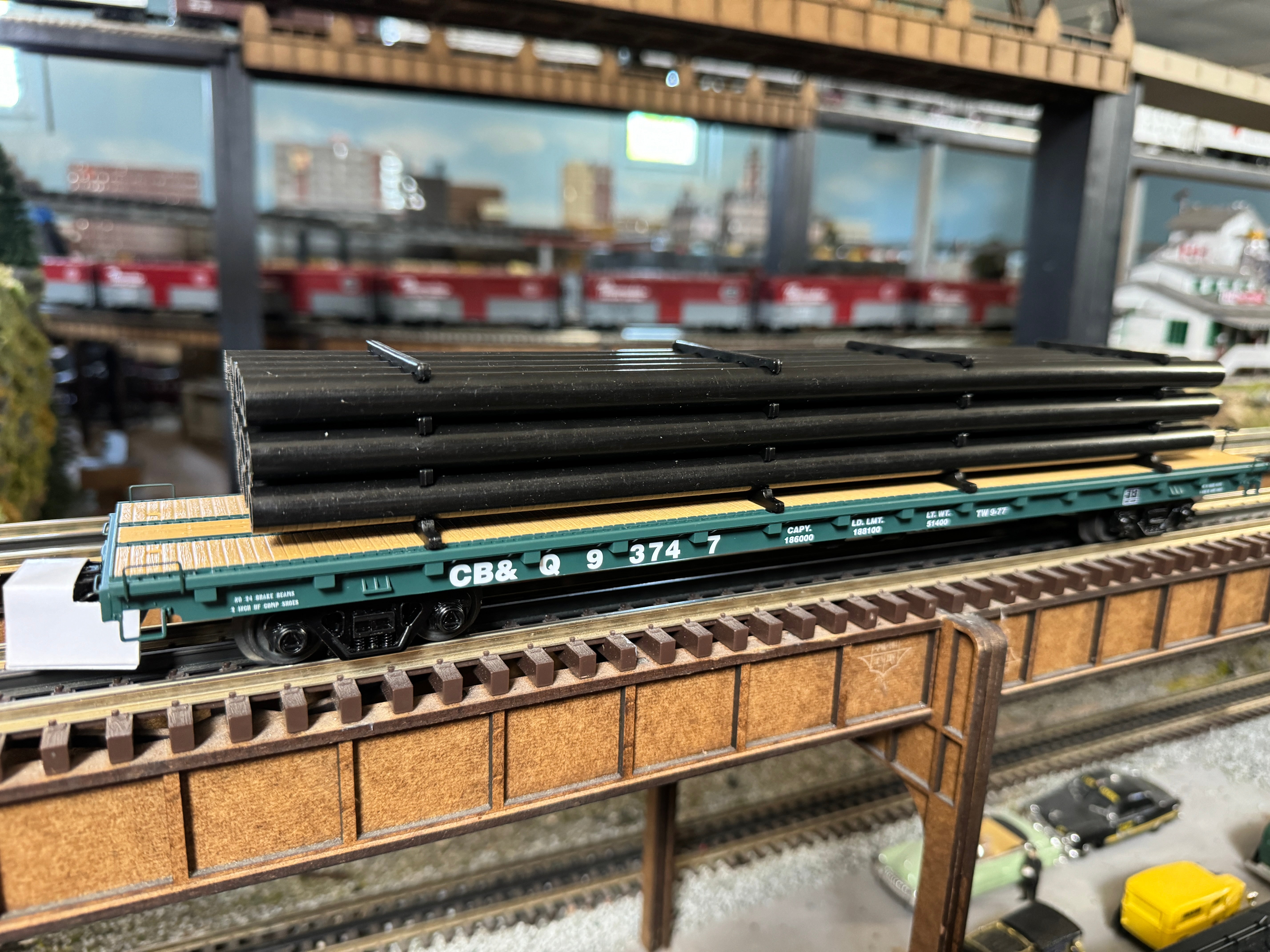 MTH 20-95573 - 60’ Flat Car "Burlington" #93745 w/ Pipe Load (Black) - Custom Run