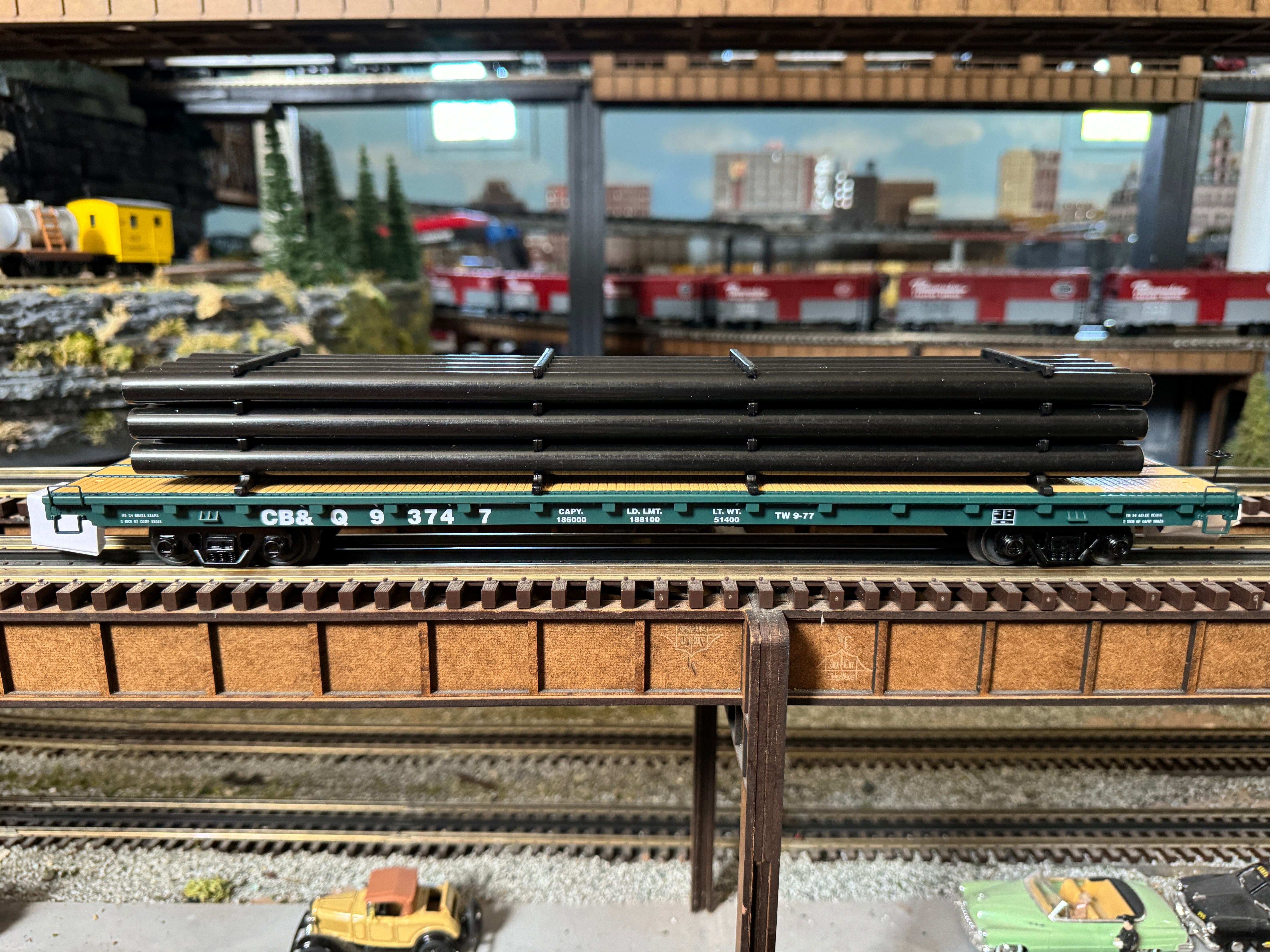 MTH 20-95573 - 60’ Flat Car "Burlington" #93745 w/ Pipe Load (Black) - Custom Run