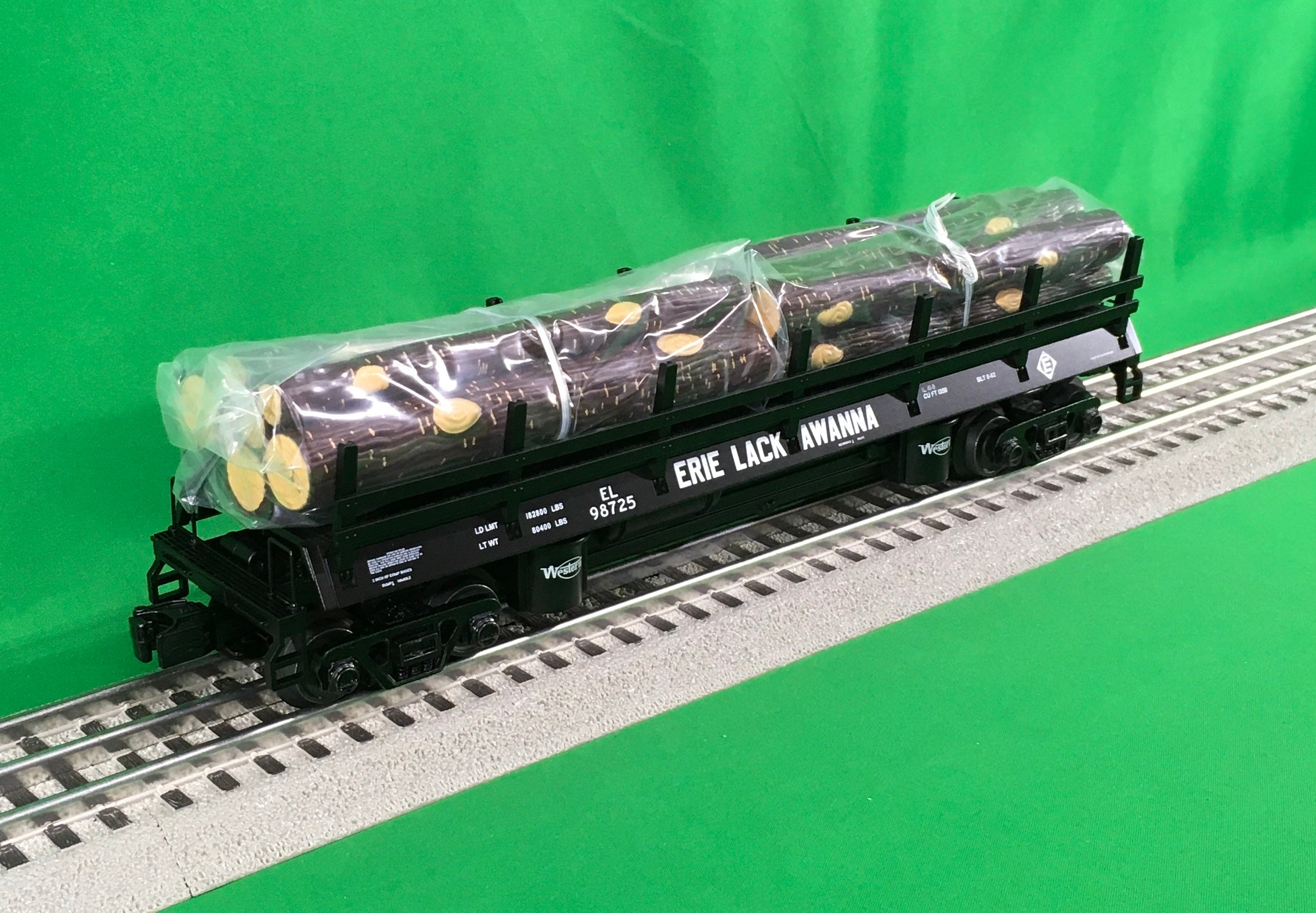 Atlas O 3001163 - Premier - Log Dump Car "Erie Lackawanna"