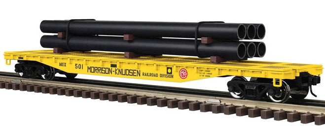 Atlas O 3002886 - Trainman - 52'6" Flat Car "Morrison Knudsen" w/ Pipe Load (2-Rail)