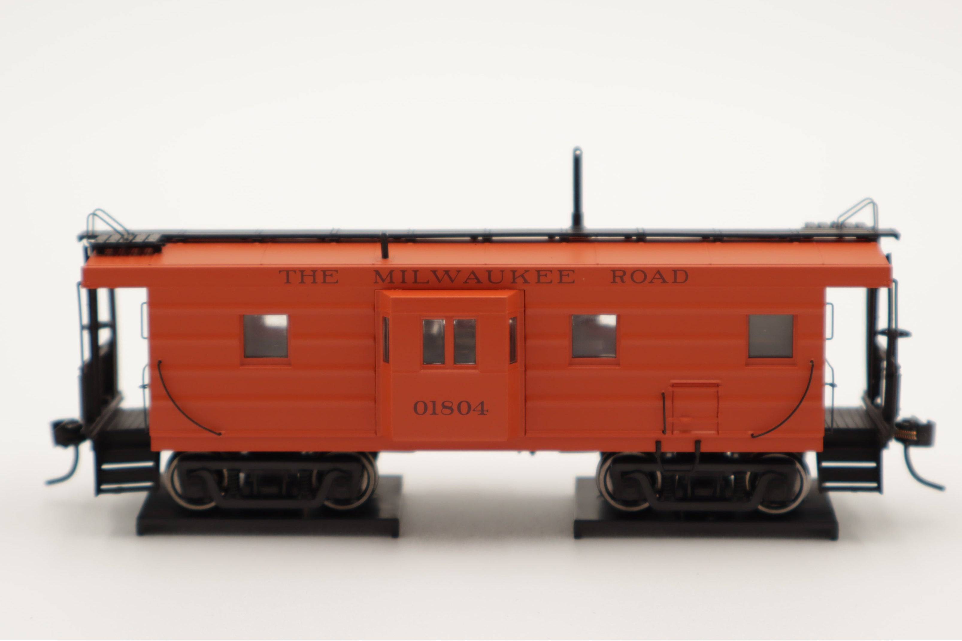 Walthers HO 920-103652 - Proto -  Rib Sided Caboose "Milwaukee Road" #01870 (Orange, Maroon; Includes Coal Stove)