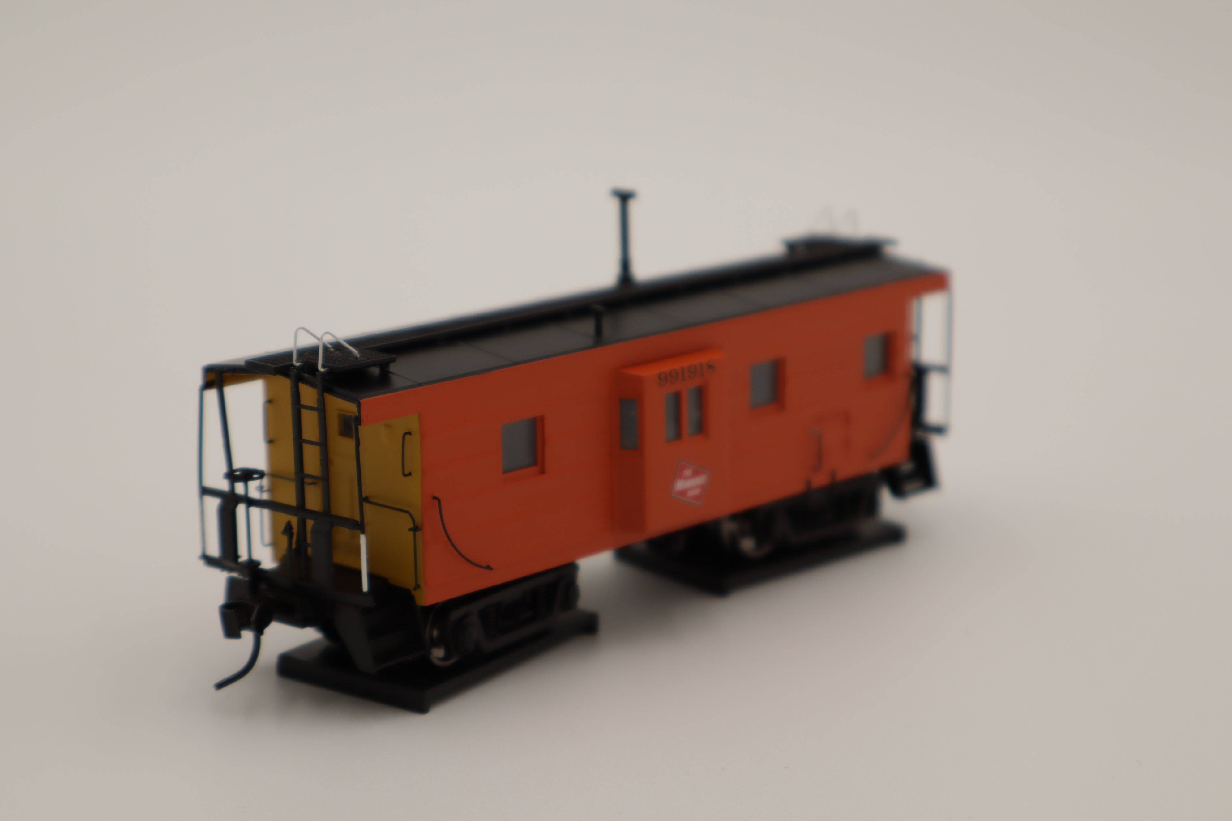 Walthers HO 920-103654 - Proto -  Rib Sided Caboose "Milwaukee Road" #991926 (Orange, Black, Yellow; Includes Oil Stove)