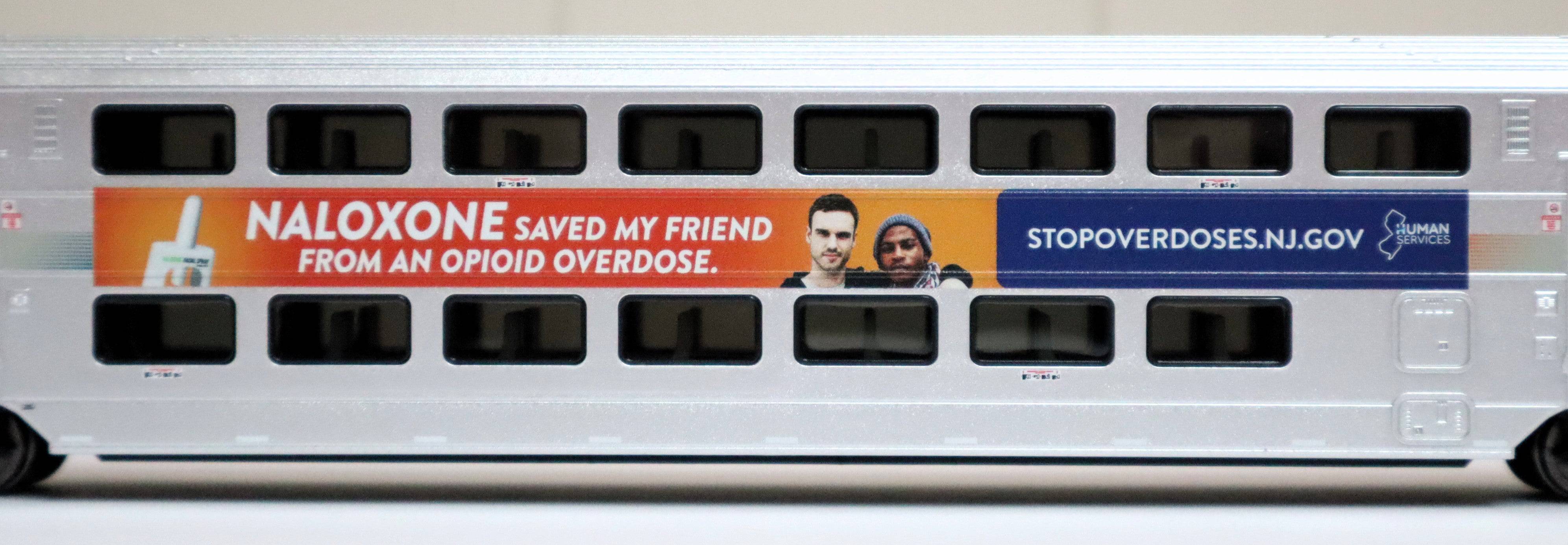 Atlas HO 20007480 - Master - Multi-Level Trailer "NJ Transit" #7504 (DHS Naloxone Wrap)