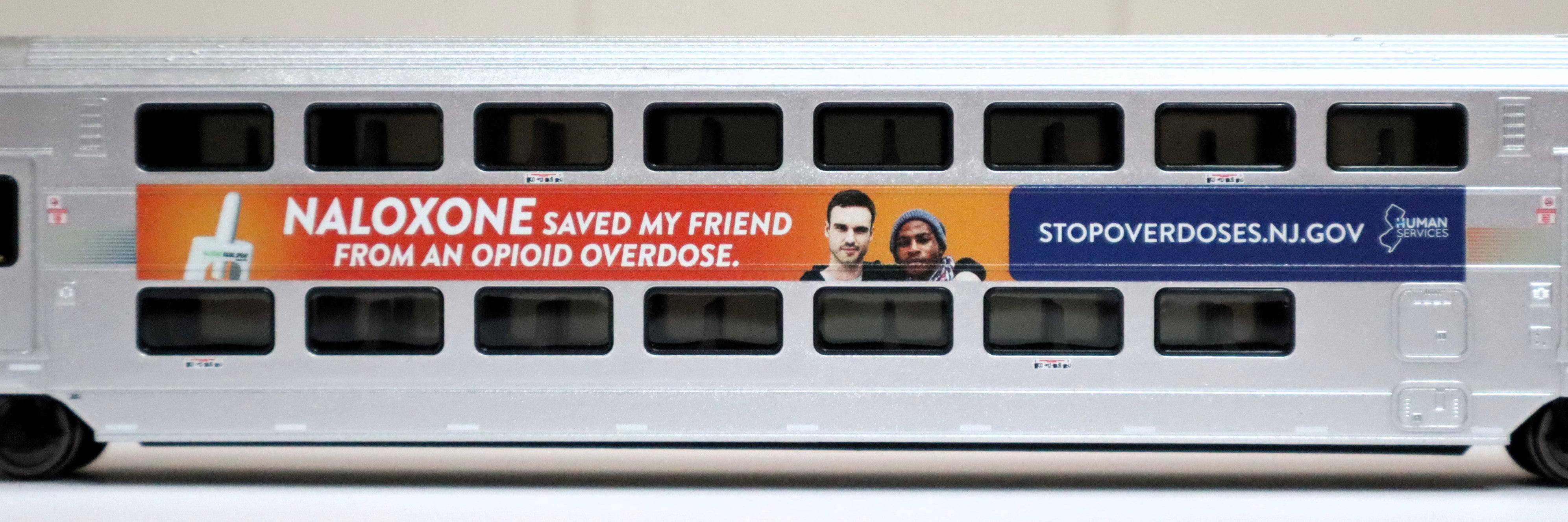 Atlas HO 20007481 - Master - Multi-Level Trailer "NJ Transit" #7513 (DHS Naloxone Wrap)