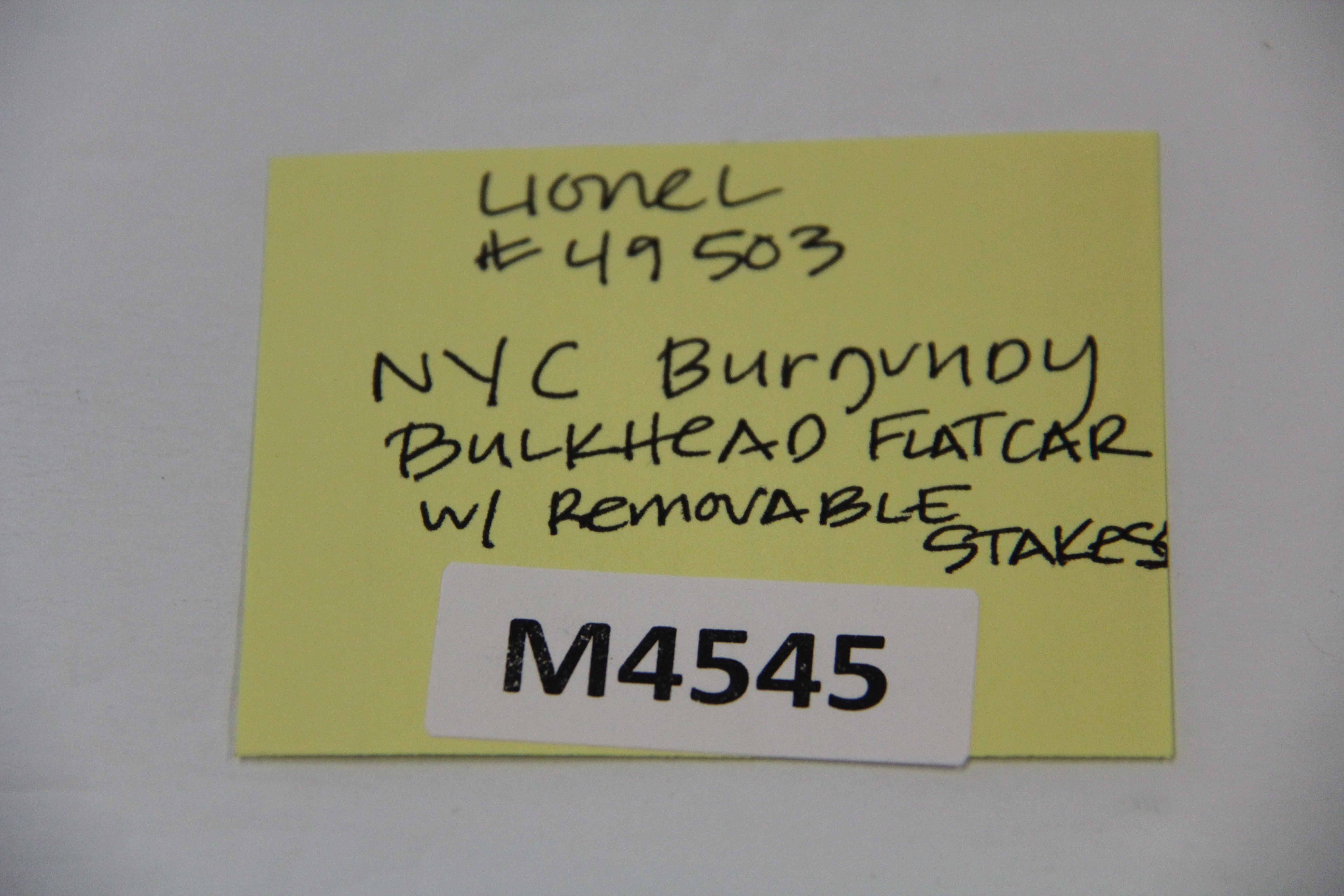 Lionel No#49503 NYC Burgundy Bulkhead Flat Car w/ Removable Stakes-Second hand-M4545