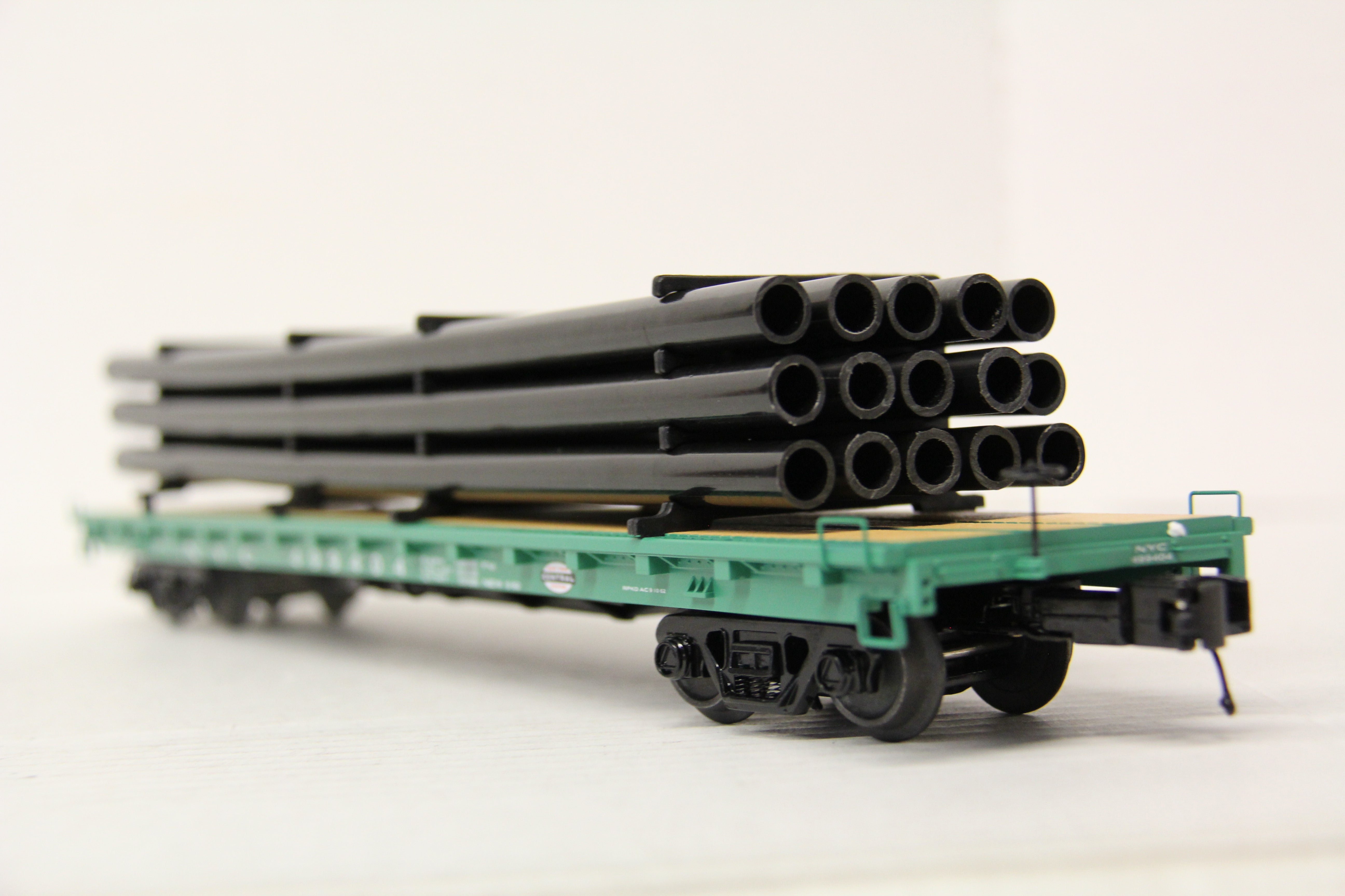MTH 20-95606 New York Central 60' Flat Car w/ Pipe Load-Second hand-M6644