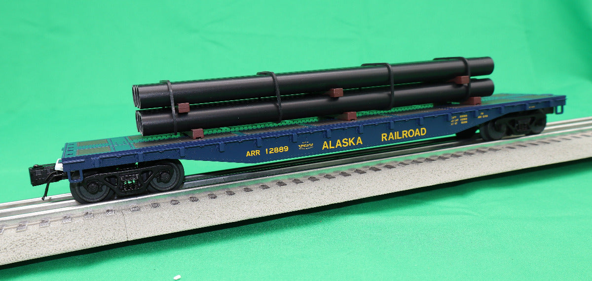 Atlas O 3001880 - Trainman - 52'6" Flat Car "Alaska Railroad" w/ Pipe Load