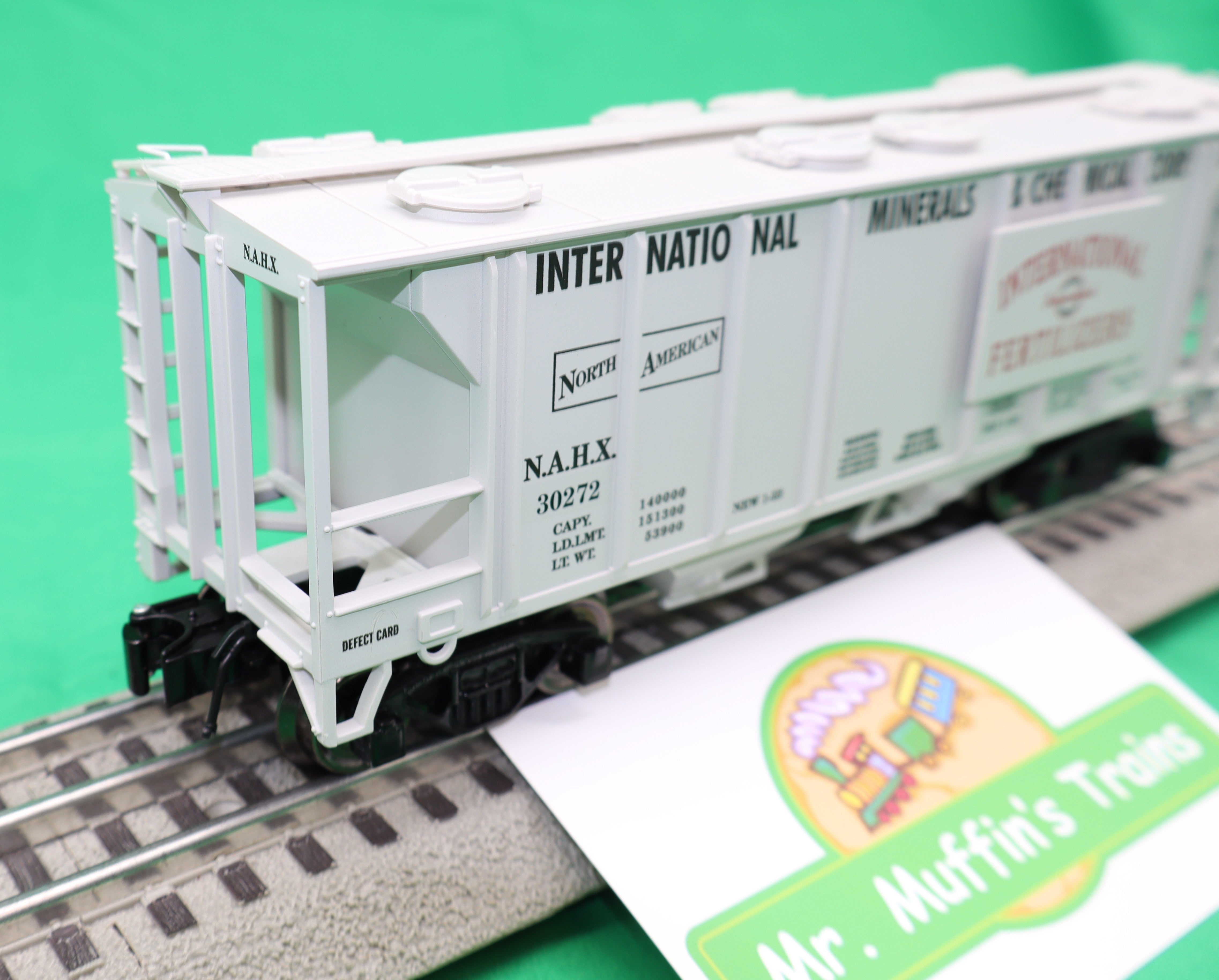 Ready Made Trains RMT-86399-102 - 2-Bay Covered Hopper Car "International Minerals"