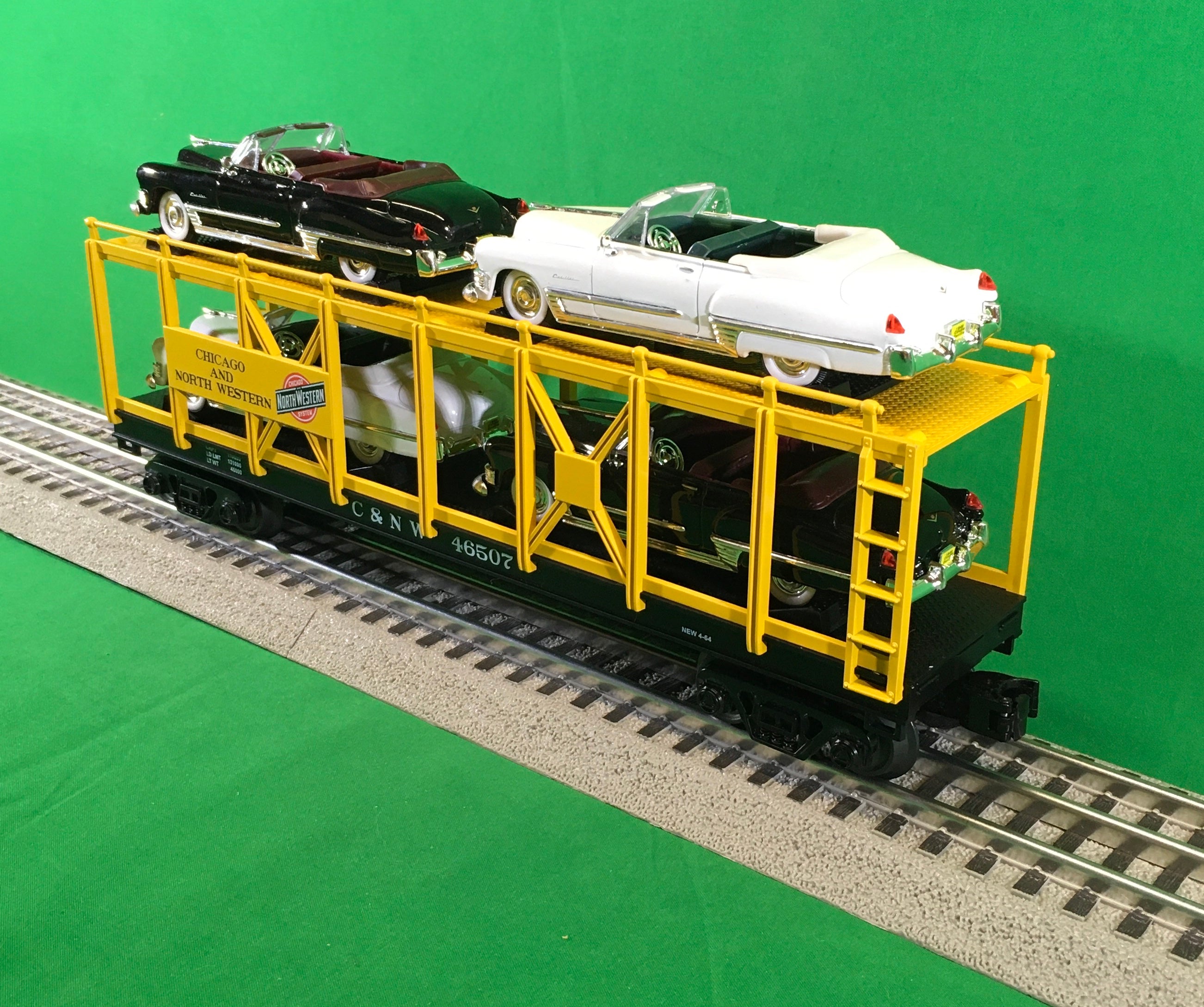MTH 30-76879 - Auto Carrier Flat Car "Chicago & North Western" w/ (4) ‘49 Cadillac Coupe De Villes #46507