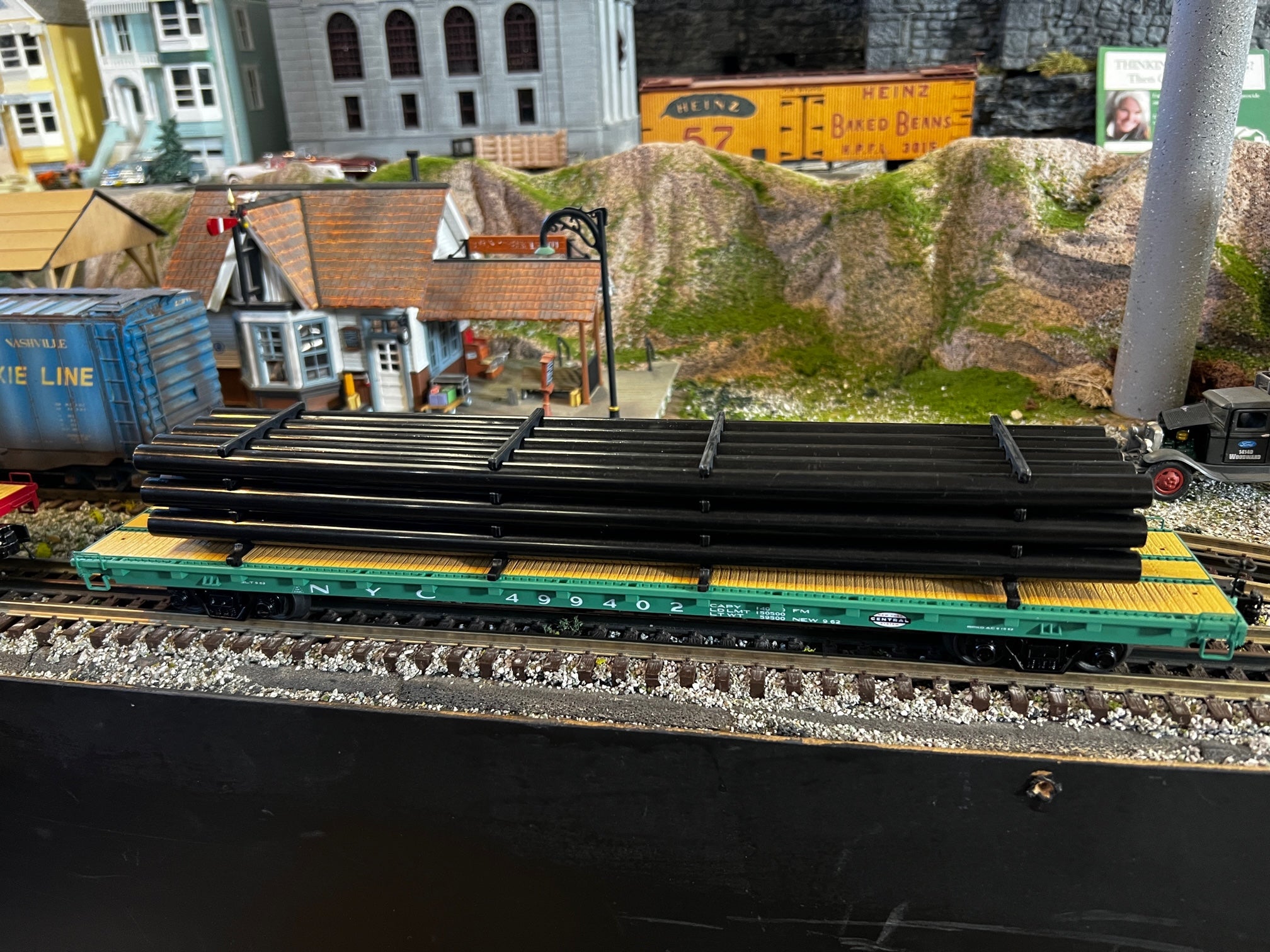 MTH 20-95605 - 60’ Flat Car "New York Central" w/ Pipe Load (Black) #499402 - Custom Run for MrMuffin'sTrains