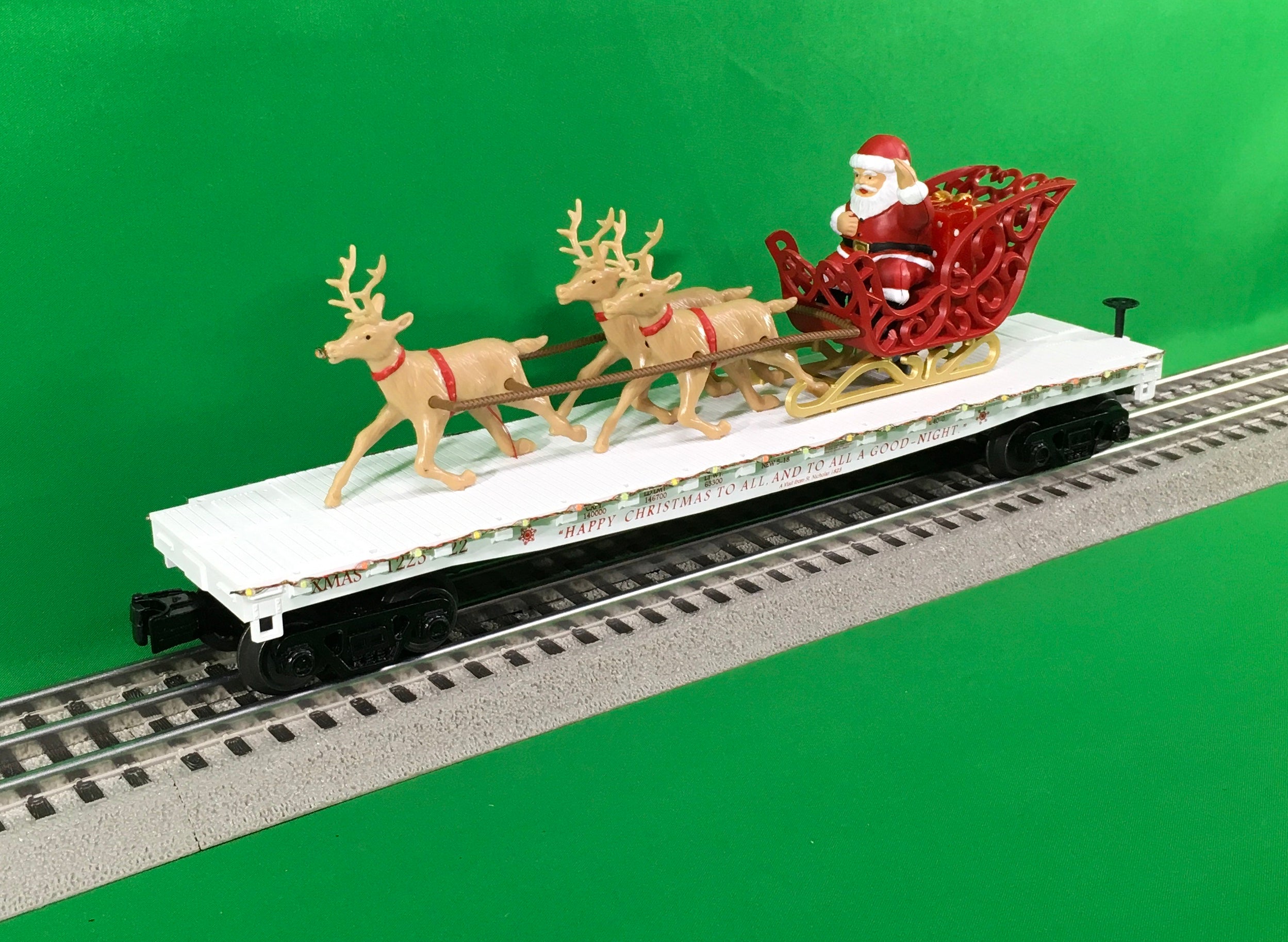 MTH 30-76862 - Flat Car "Christmas" w/ LED Lights, Santa Sleigh & Reindeer (White)