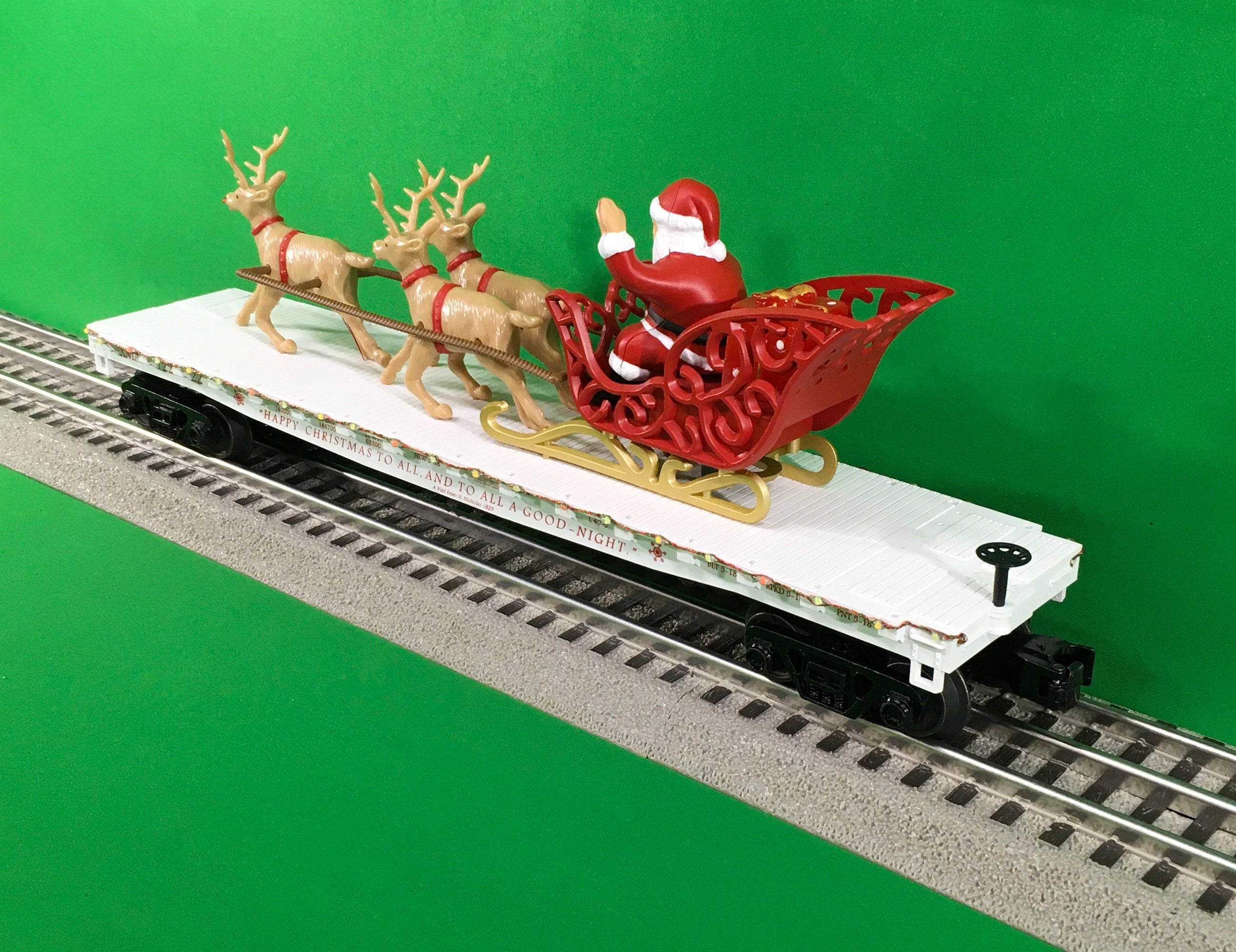 MTH 30-76862 - Flat Car "Christmas" w/ LED Lights, Santa Sleigh & Reindeer (White)
