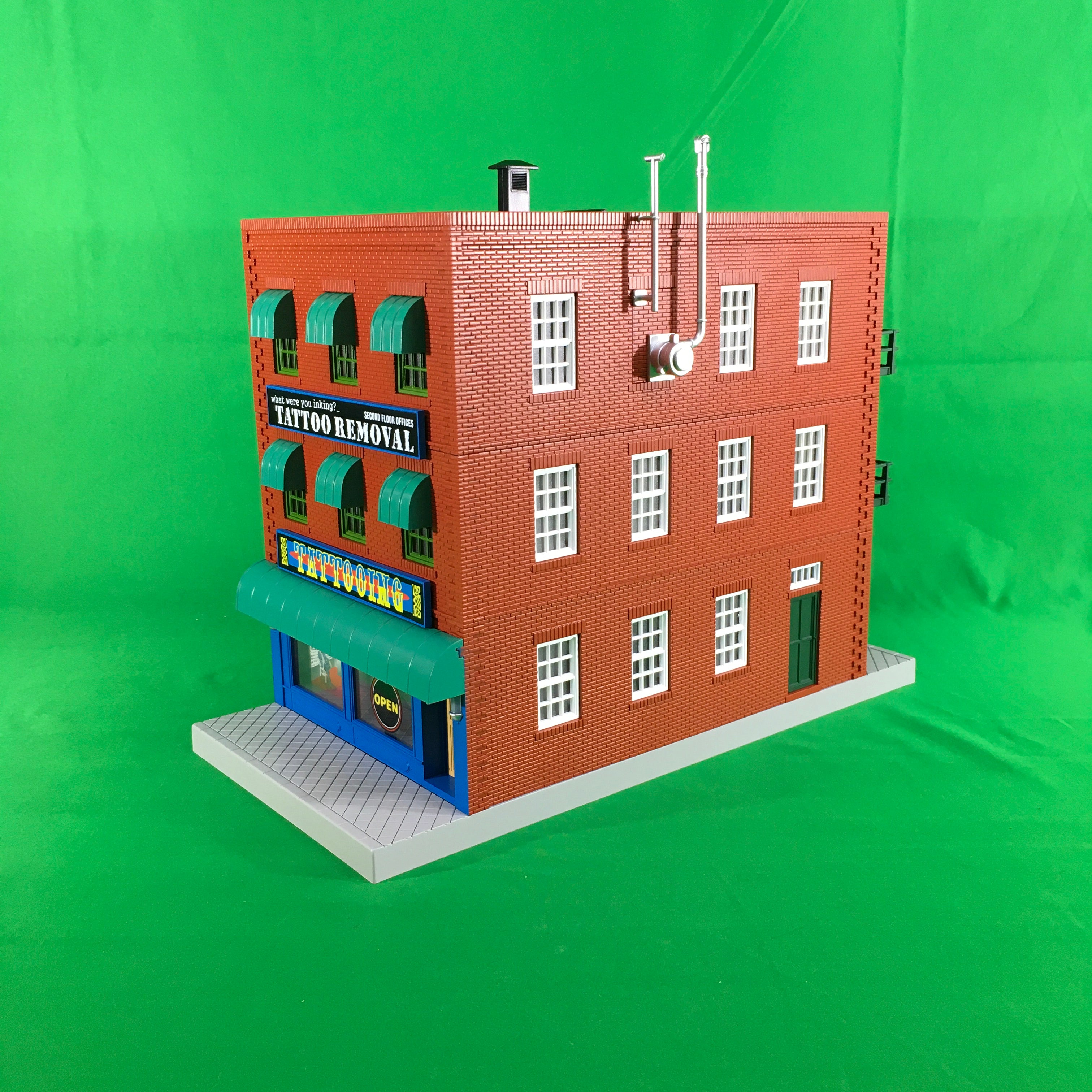 MTH 30-90566 - 3-Story City Building "What were you inking - Tattoo Removal" w/ Fire Escape & Blinking Sign