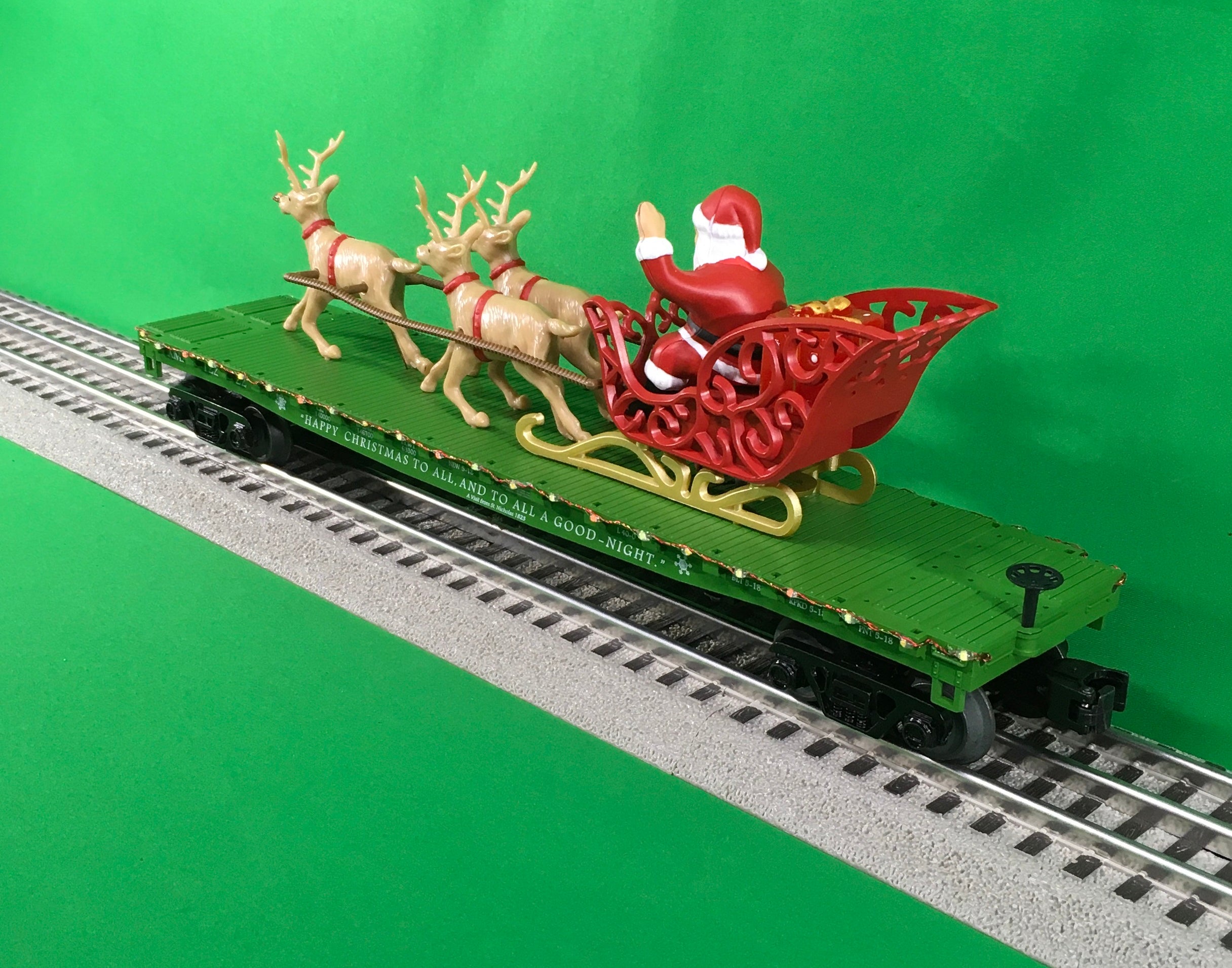 MTH 30-76860 - Flat Car "Christmas" w/ LED Lights, Santa Sleigh & Reindeer (Green)