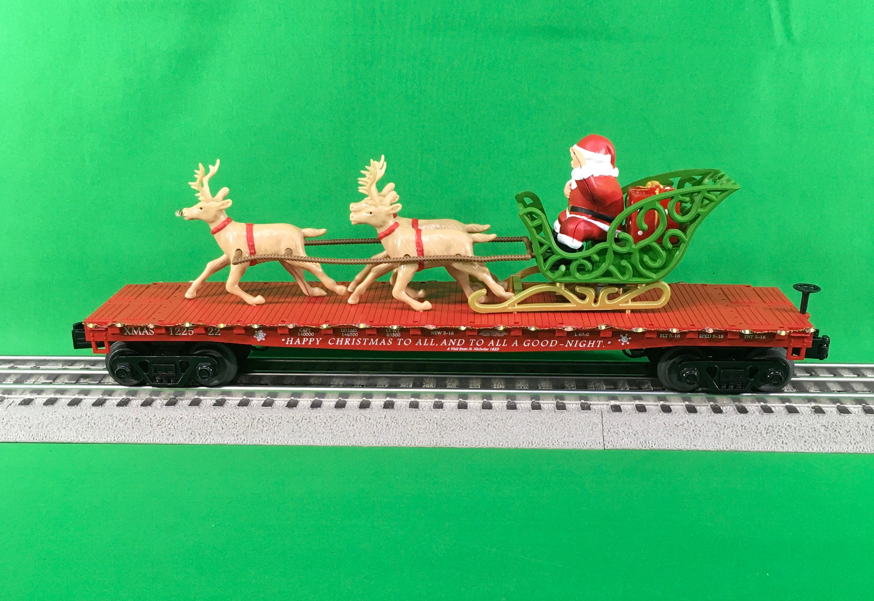 MTH 30-76861 - Flat Car "Christmas" w/ LED Lights, Santa Sleigh & Reindeer (Red)